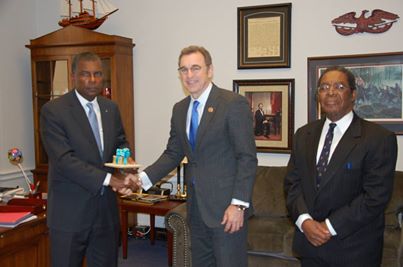 WASHINGTON, D.C. -- Minister of Foreign Affairs and Immigration Fred Mitchell met today (Tuesday, Feb. 11) with Congressman Matt Salmon (R-AZ), Chairman of the Subcommittee on the Western Hemisphere of the House Committee on Foreign Affairs, at his congressional office in the Rayburn House Office Building on Capitol Hill.  Mr. Mitchell, who is on a two-day visit to Washington, D.C., was accompanied by His Excellency Dr. Eugene Newry, Bahamas Ambassador to the United States, and Mr. Chet Neymour, Deputy Chief of Mission. During the 45-minute meeting, Minister Mitchell and Congressman Salmon discussed several issues of mutual interest to The Bahamas and the United States. Congressman Salmon noted that he has visited The Bahamas on several occasions and “I really value and respect our relationship with The Bahamas.” Mr. Mitchell (left) is seen presenting Congressman Salmon with a gift following their meeting. At right is Ambassador Newry.