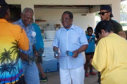 Photo: JUNKANOO DIPLOMACY? -- His Excellency Dr. Eugene Newry (right), Bahamas Ambassador to the United States, joined in a Junkanoo Rush Out at the picnic hosted by the Bahamian-American Association on Saturday, July 12, at the U.S. Coast Guard Base, 7323 Telegraph Road, Alexandria, from 1:00 p.m. to 7:00 p.m. At left is Mr. Bernard Colebrooke, a Bahamian who is a retired U.S. Marine and one of the leaders of the Bahamian-American Association. The picnic was one of the events held over the weekend to celebrate the 41st anniversary of The Bahamas’ attainment of independence. An official independence anniversary reception was held at the St. Regis Hotel, 923 16th and K Streets, N.W., in downtown Washington on Friday, July 11, and an independence church service was held on Sunday, July 13, at the African Methodist Episcopal Church (AME), 1518 M Street, N.W., Washington, D.C., at which the Bahamas National Youth Choir was the featured choir.