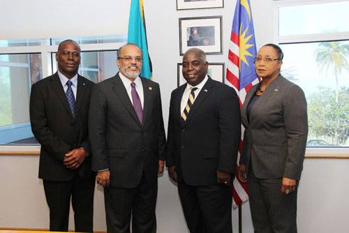 Photo: Deputy Prime Minister and Acting Minister of Foreign Affairs and Immigration, Philip 'Brave' Davis, receives High Commissioner Designate of Malaysia, Jojie Samuel M.C. Samuel, in a courtesy call, Nov. 19, 2013. Pictured from left: Permanent Secretary, Philip Miller; High Commissioner Designate Samuel; DPM Davis; and  Parliamentary Secretary, Cleola Hamilton. (BIS Photo/Raymond A. Bethel Sr.)